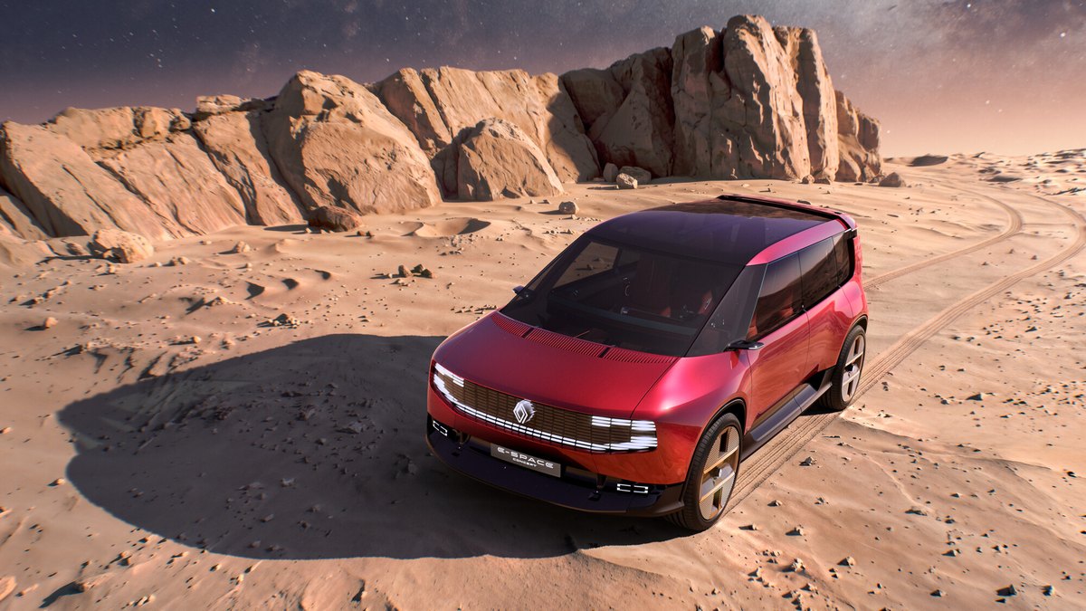 Renault E-Space Concept z boku na tle przeszklonej architektury, sylwetka vana z 23-calowymi kołami
